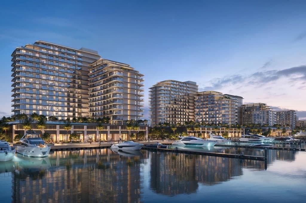Fior at Rashid Yachts & Marina — waterfront residences over the superyacht marina at dusk